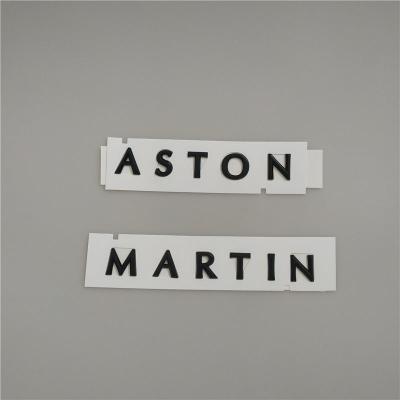 Aston Martin DBX Script Badge Rear Emblem Glossy Black MY83-001B40-CA
