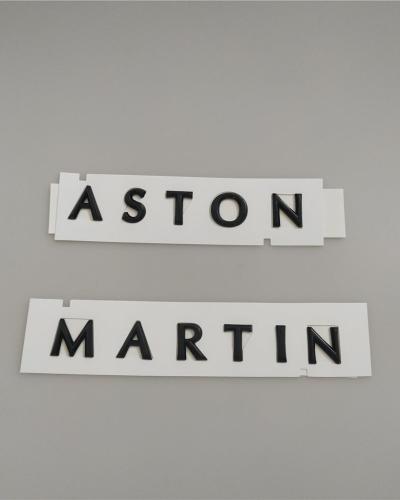 Aston Martin DBX Script Badge Rear Emblem Glossy Black MY83-001B40-CA